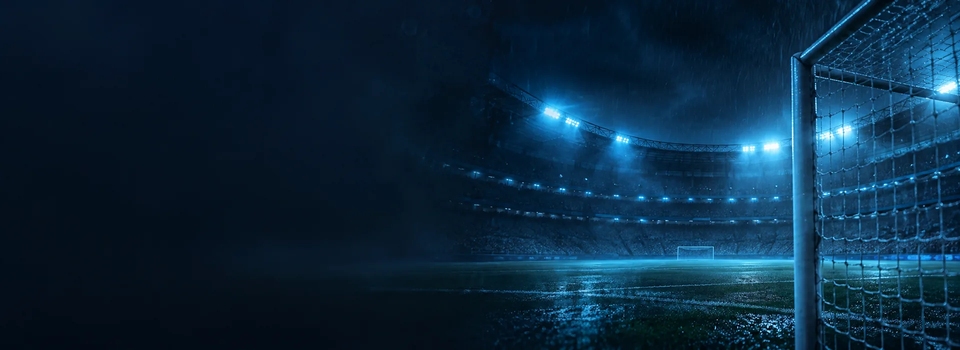 Floodlit cricket stadium at night